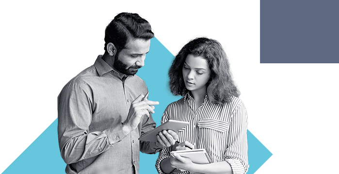 A man and woman looking over their business account through the Stellar Bank Mobile App
