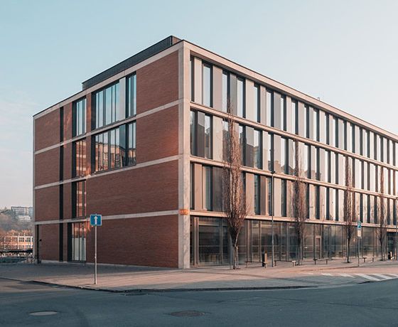 The outside of a municipal building at sunset