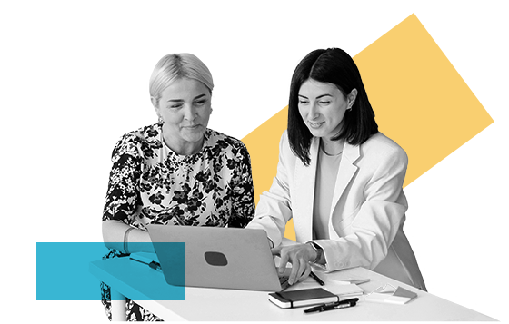 A female Stellar Bank teller working on a laptop with a customer