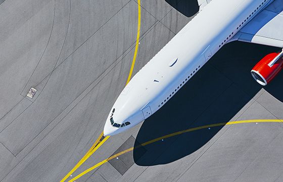 A plane moving out onto a runway