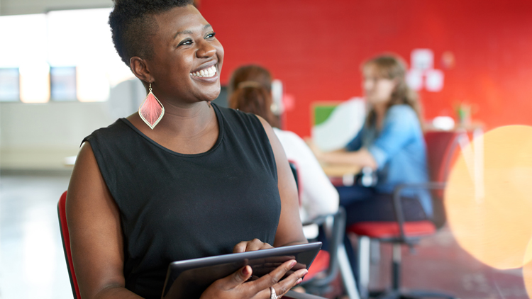 Woman with ipad taking orders or conducting business