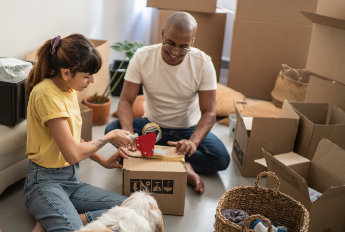 young couple packing boxes