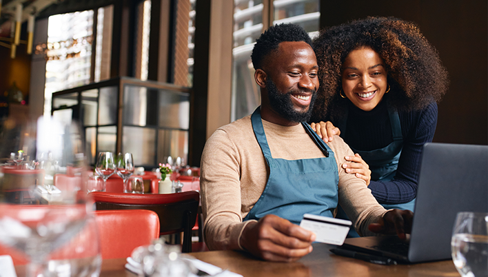 Minority entrepreneurs working in a restaurant.